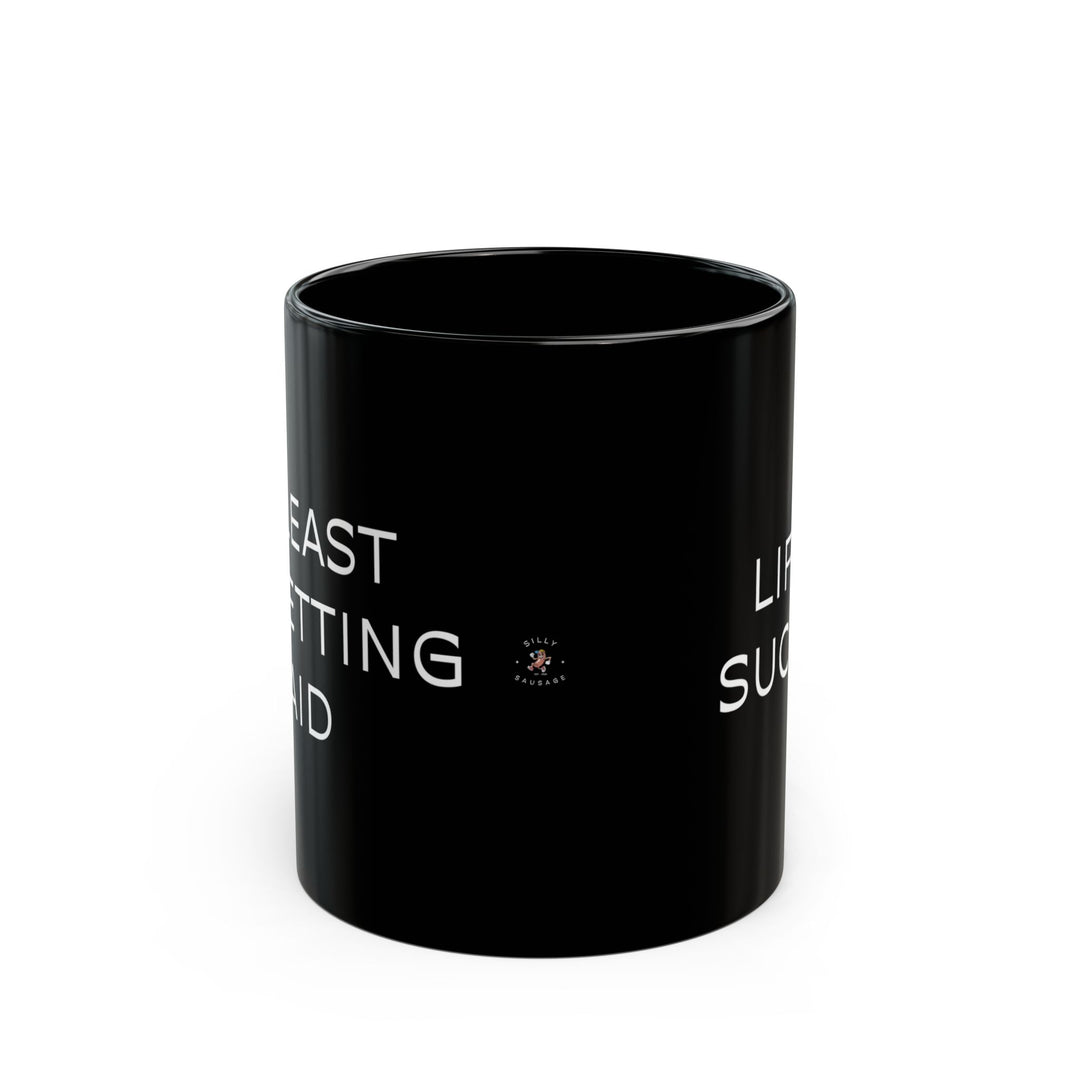 At Least I'm Getting Paid – Life Sucks – Black Mug