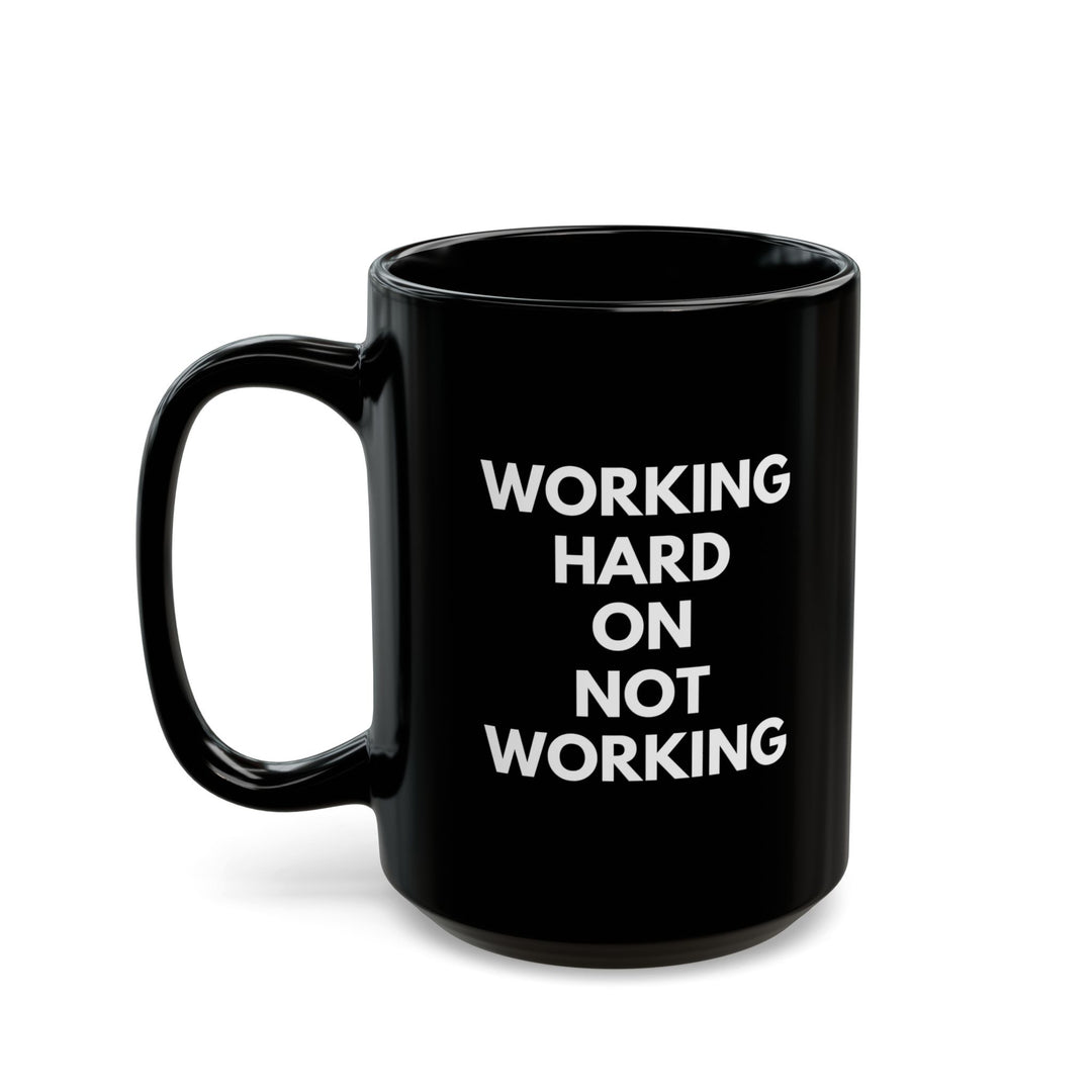 Working Hard on Not Working – Black Mug