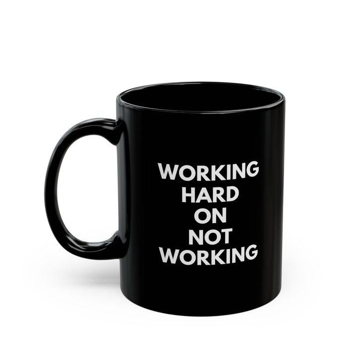 Working Hard on Not Working – Black Mug